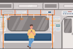 電車の中でスマートフォンを操作する男性